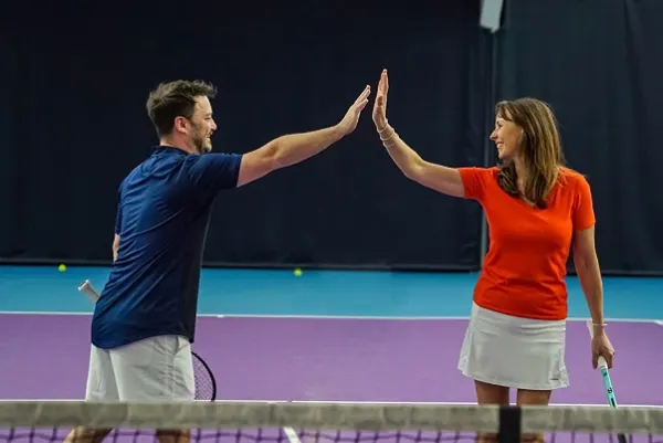 The expansive multi-court indoor tennis space at the club