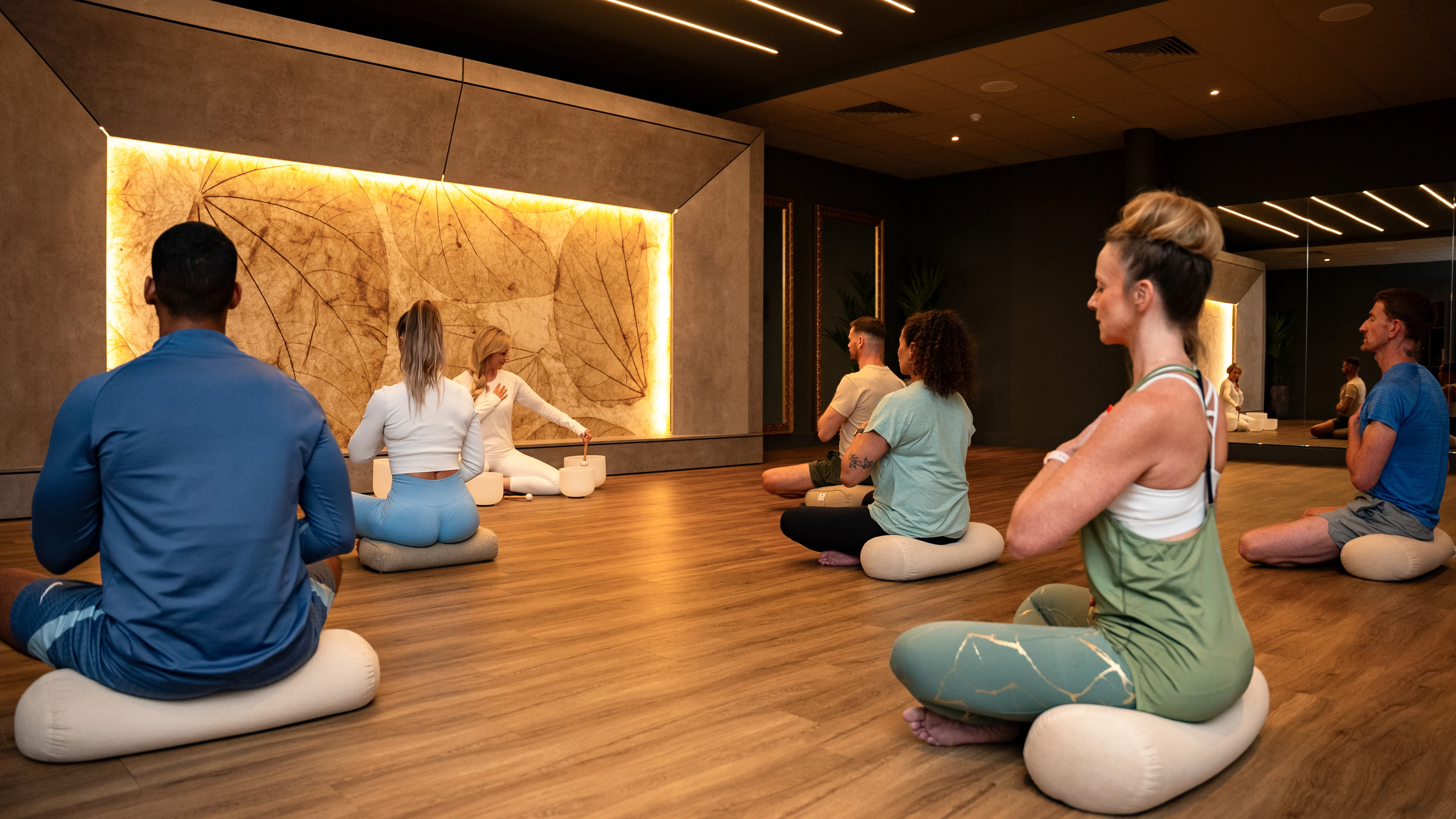 People in a yoga class at a David Lloyd club.