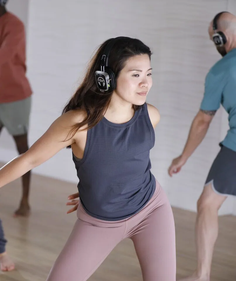 A woman dancing and smiling