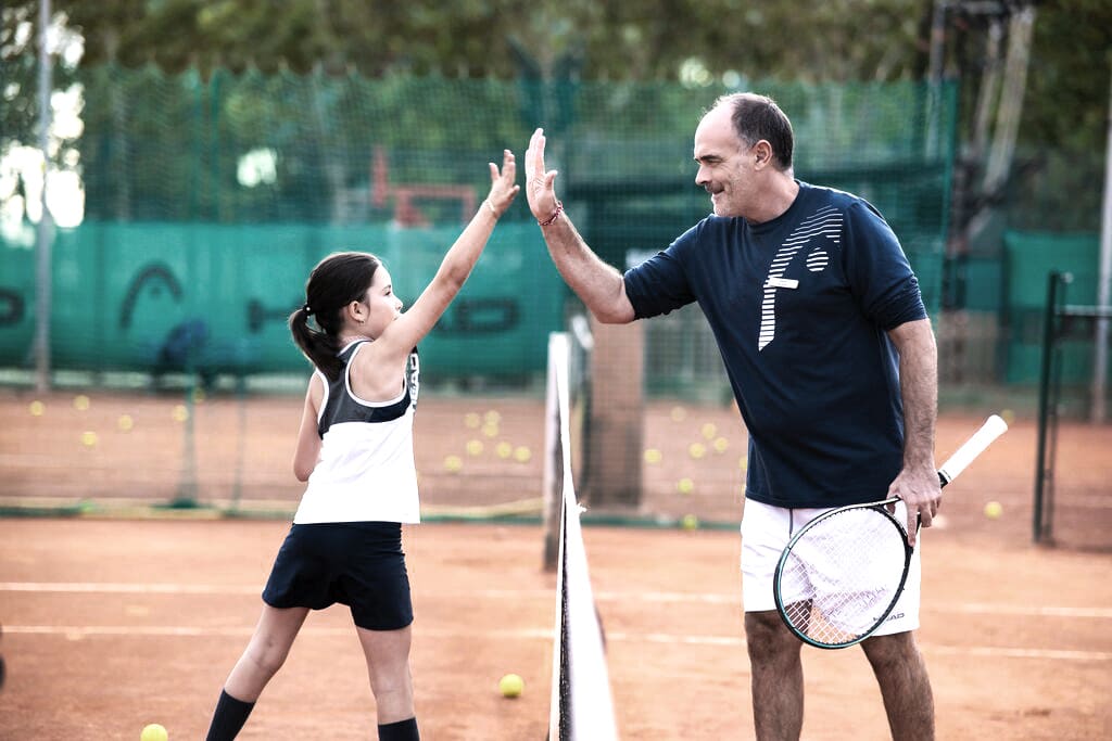 Family tennis match at David Lloyd Clubs