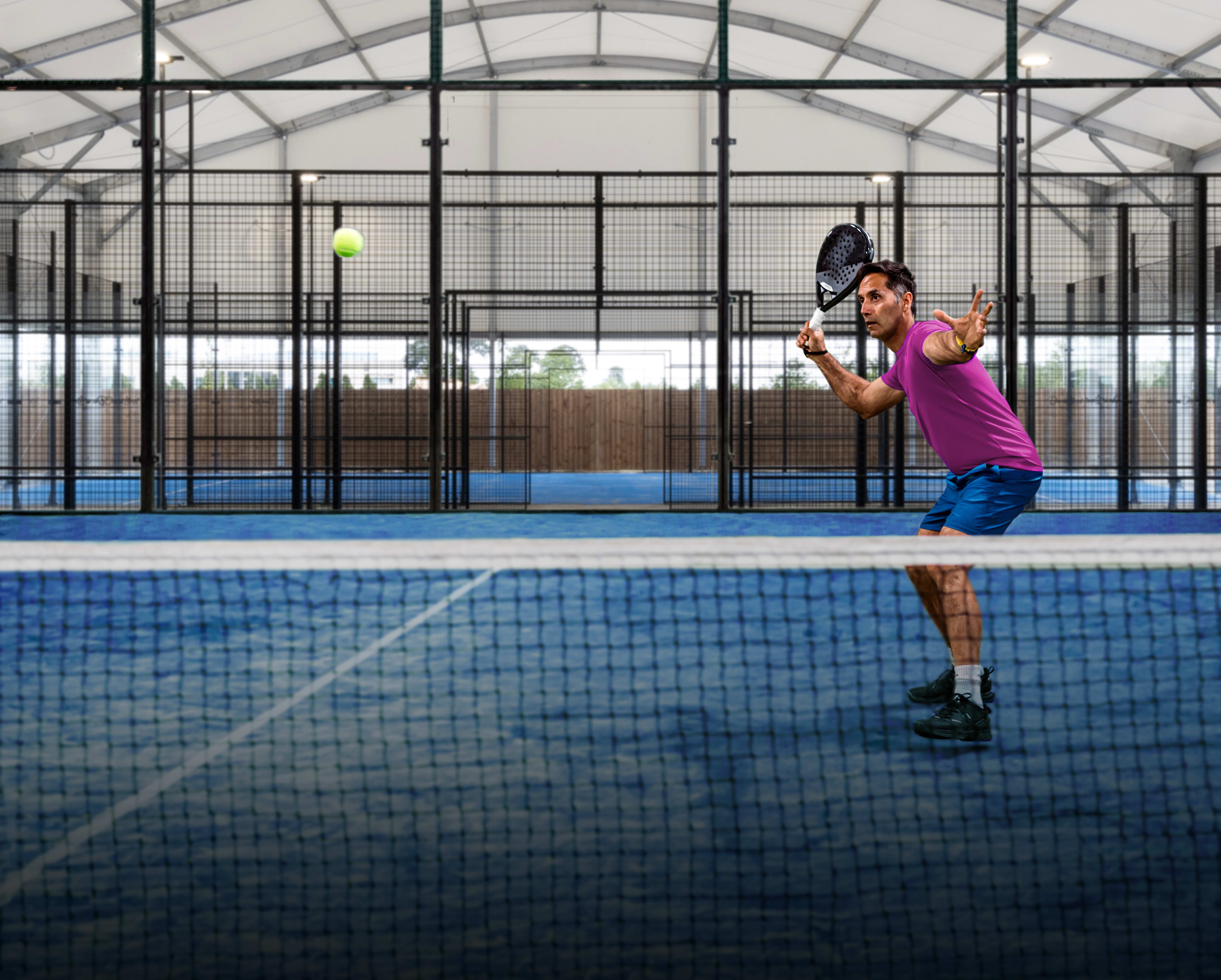 Man playing on an indoor court