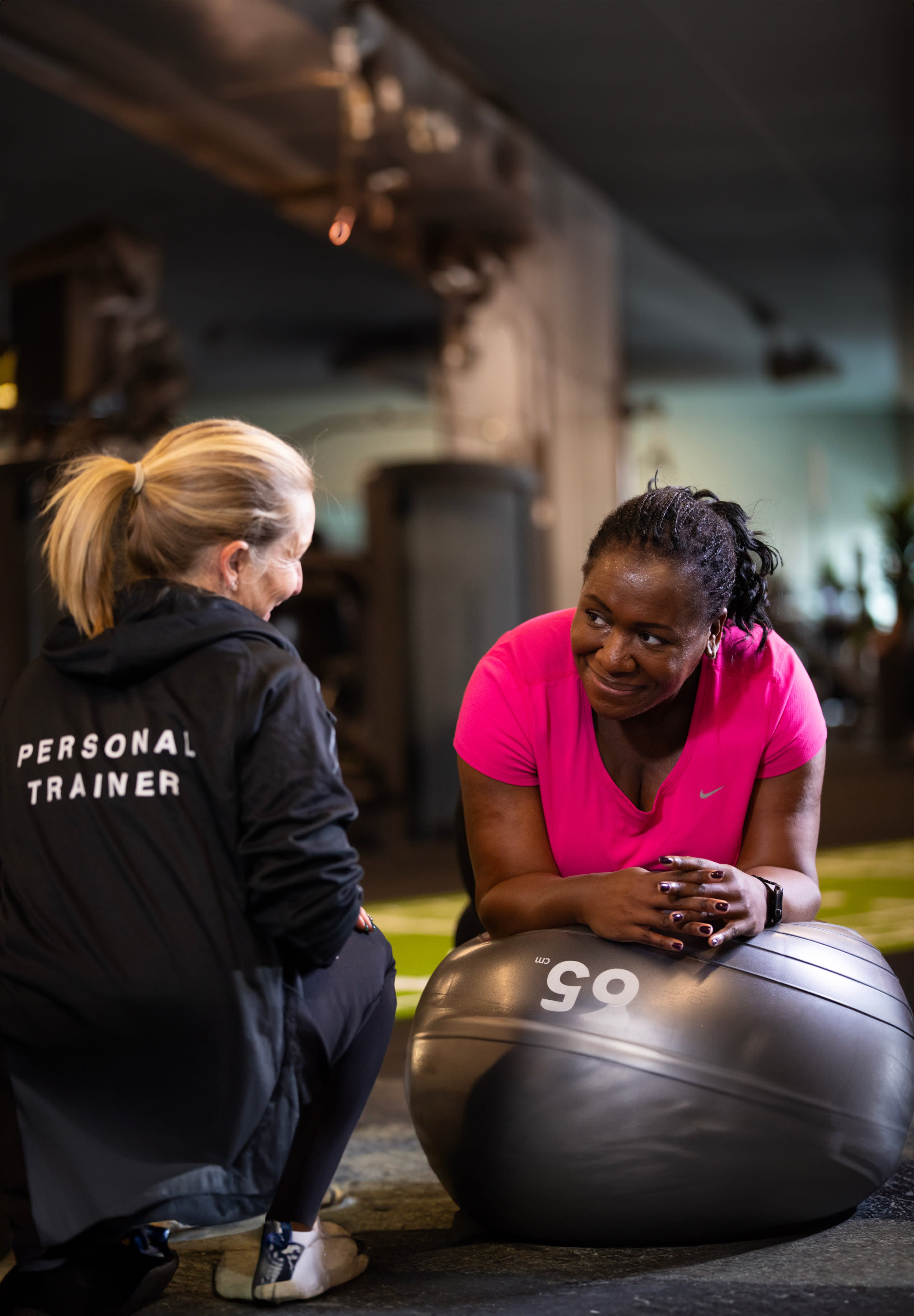 Woman talking to personal trainer