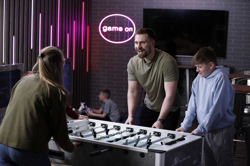 Family playing table football