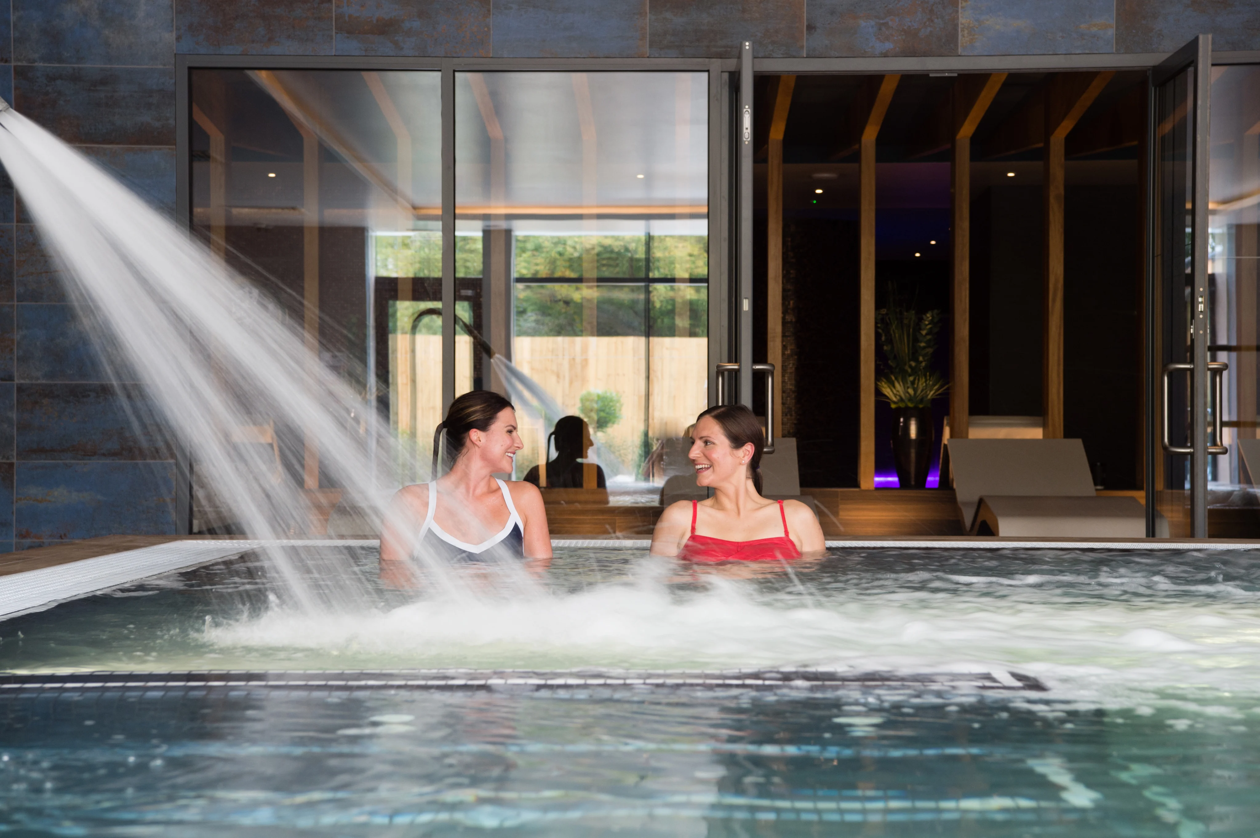 Women enjoying a bathe in a spa pool.