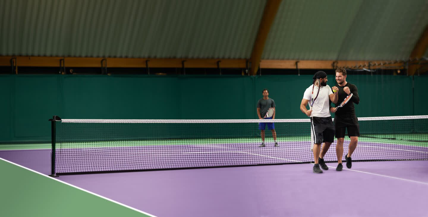 Two men playing tennis