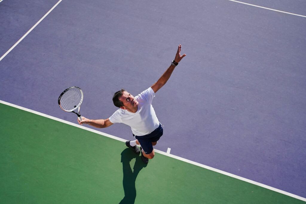 People playing tennis.