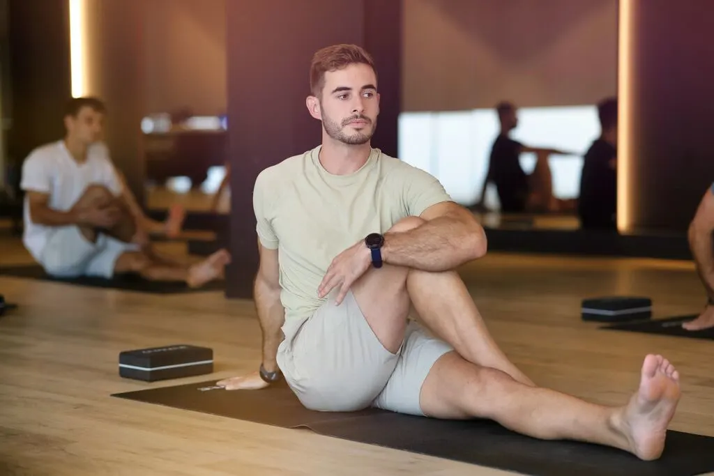 A man doing a seated twist.