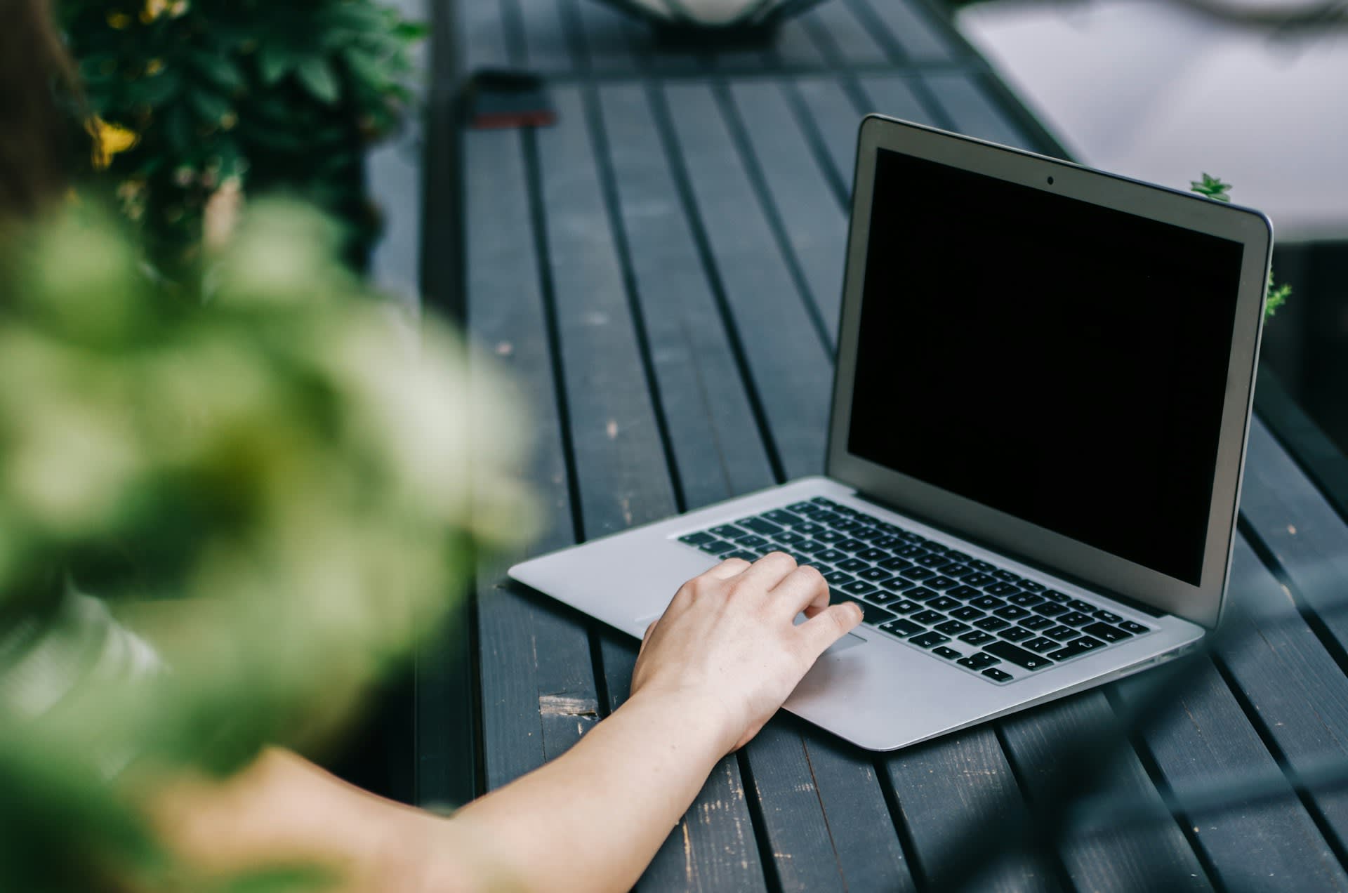 A laptop on an outdoor table