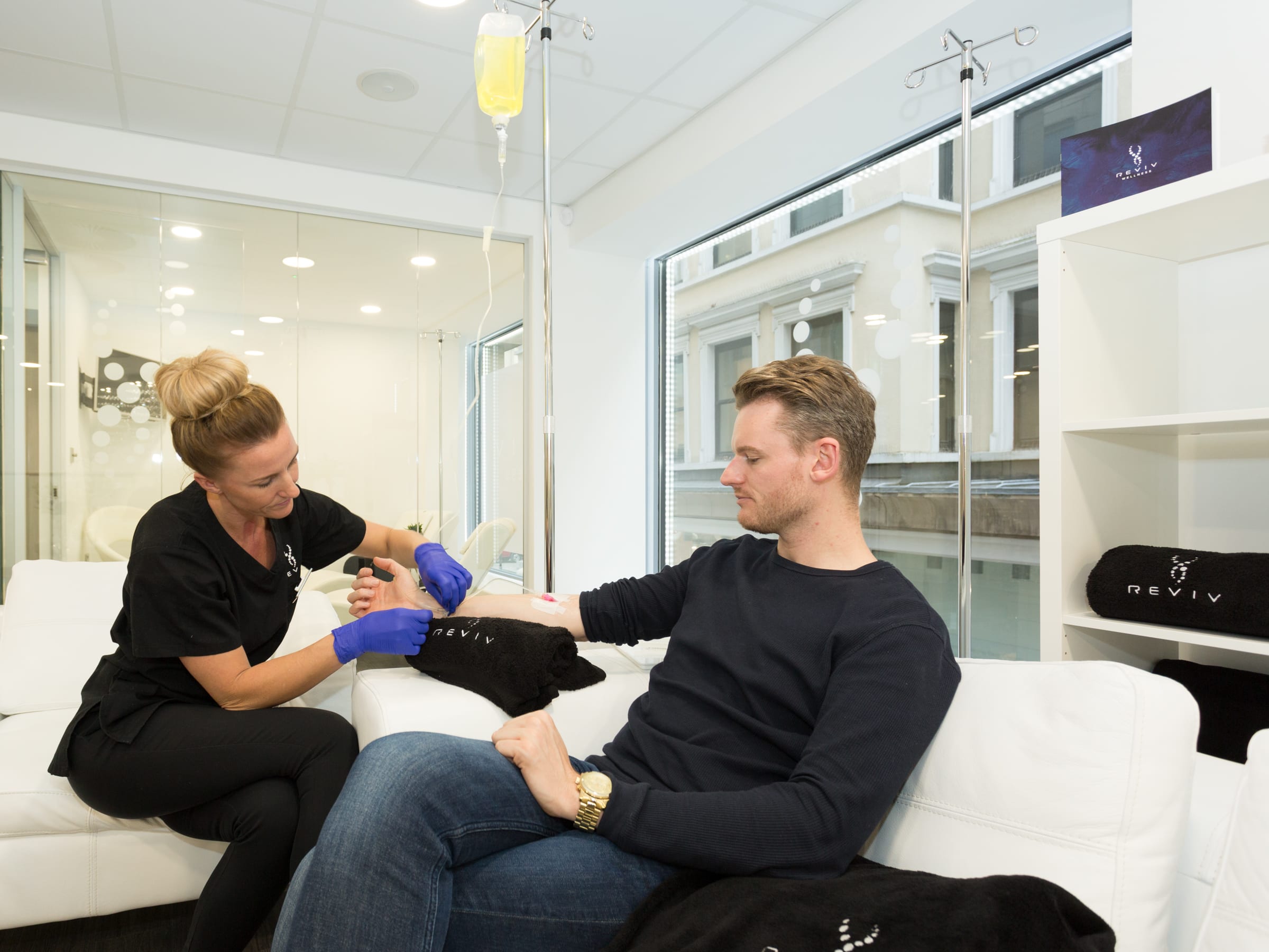 Man receiving IV treatment at a REVIV clinic