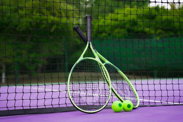 Tennis racquets on an outdoor court at David lLoyd Clubs